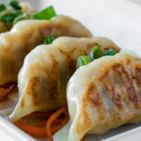 Gyoza (4 Pieces) · Pan fried dumplings with pork and cabbage.