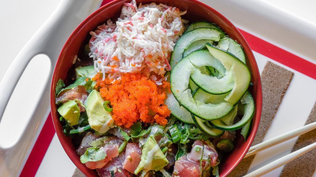 Ahi Poke Bowl · Tuna tossed with wakame, avocado, cilantro, and green onions. Comes with imitation crab, cucumber and is topped with masago, and Wasabi Mayo.
Served over your choice of rice or salad.