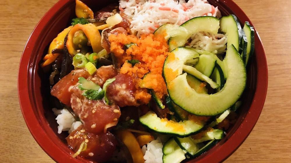 Spicy Ahi Poke Bowl · Tuna tossed with squid salad, green onion and cilantro. Comes with imitation crab, cucumber, and is topped with masago, and Spicy Mayo.
Served over your choice of rice or salad.