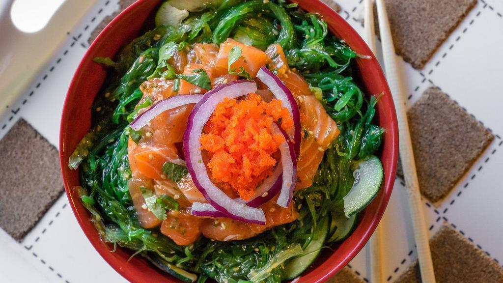 Shoyu Poke Bowl · Choice of Tuna or Salmon, tossed with green onion and cilantro. Comes with imitation crab, cucumber, wakame, and is topped with red onions, masago, and sesame oil, light soy sauce, and ponzu.
Served over your choice of rice or salad.