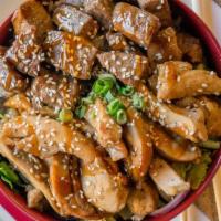 Teriyaki Duo Hot Bowl · Steak and chicken marinated in our house made teriyaki sauce. Topped with toasted sesame see...
