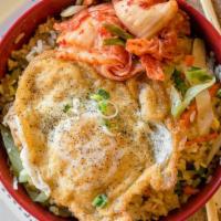 Sun Rice Hot Bowl · Fried rice with chicken, carrots, celery, cabbage, green onions, white onions, and is topped...