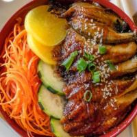 Unagi Bowl · Oven broiled eel. Comes with imitation crab, cucumber, carrots, pickled radish, topped with ...