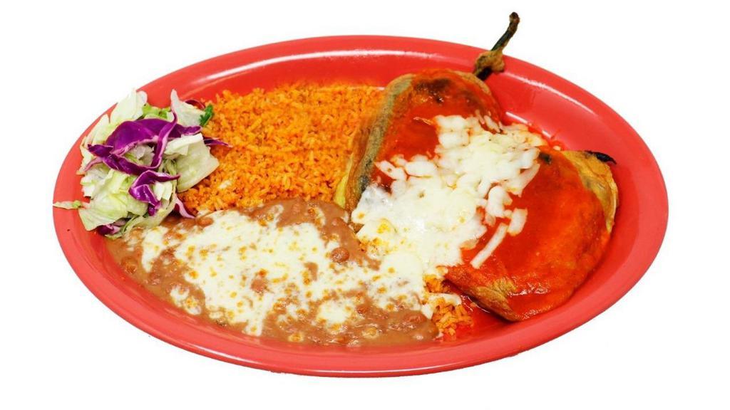 Two Chile Rellenos · Home made pasilla chile stuffed with Monterey cheese, and dipped in egg. Topped with salsa ranchera and cheese. All the chiles rellenos are homemade. Served with rice and beans.