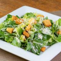 Caesar Salad · Crispy romaine, parmesan cheese and herbed croutons, tossed in a classic Caesar dressing.