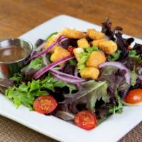 House Salad · Mixed greens, tomato, red onions and croutons served with balsamic vinaigrette.