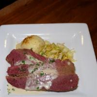 Corned Beef & Cabbage · Slow braised corned beef with , cabbage, creamy mashed potatoes & white sauce