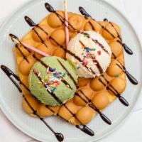 Egg Puffs · Hong Kong style egg waffle, delicious with fresh fruit, chocolate sauce, whipped cream or yo...