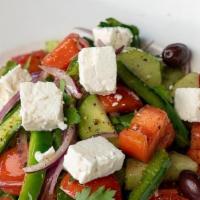 GREEK SALAD · Tomato, cucumber, green bell pepper, red onion, parsley, feta cheese and olive oil lemon vin...