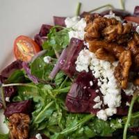 BEETS SALAD · Braised beets, arugula, red onion, candied walnuts, goat cheese and pomegranate dressing