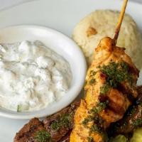 MIX KEBAB COMBO PLATE · Chicken kebab + Lamb tender kebab , rice pilaf, sautéed vegetables and tzatziki sauce