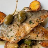 BRANZINO · Pan seared filets of Branzino, brussel sprouts, baby potatoes, berry capers and white wine l...