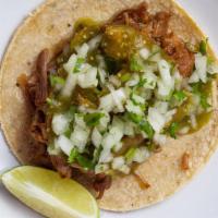 CARNITAS Tacos · three pulled pork tacos on house-made tortillas, cilantro, onions, salsa roja