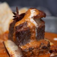 Massaman Beef  Short Rib Curry · Braised Beef Short Rib, Coconut Base Curry, Roasted Peanut, Sweet Potato, Onion, Ginger Stri...