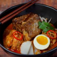 Laksa Curry Beef Short Rib Noodle Soup · Braised Beef Short Rib, Wavy Ramen Noodles, Curry Broth, Egg, Sweet Potato,  Fried Bean Curd...