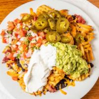 IRISH NACHOS · French Fries topped with Shredded Corned Beef,  
Jack and Cheddar Cheese, Salsa Fresca, Sour...