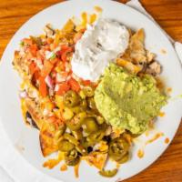 Novato Nachos · Homemade tortilla chips topped  with black beans, grilled chicken,  jack & cheddar cheese,  ...