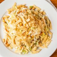 Sesame Chicken Salad · Savoy and Napa cabbages with grilled chicken, green onions and roasted peanuts tossed in a s...