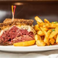 World's Best Corned Beef Reuben · Corned Beef and swiss on marbled rye with thousand island and ale steamed sauerkraut.