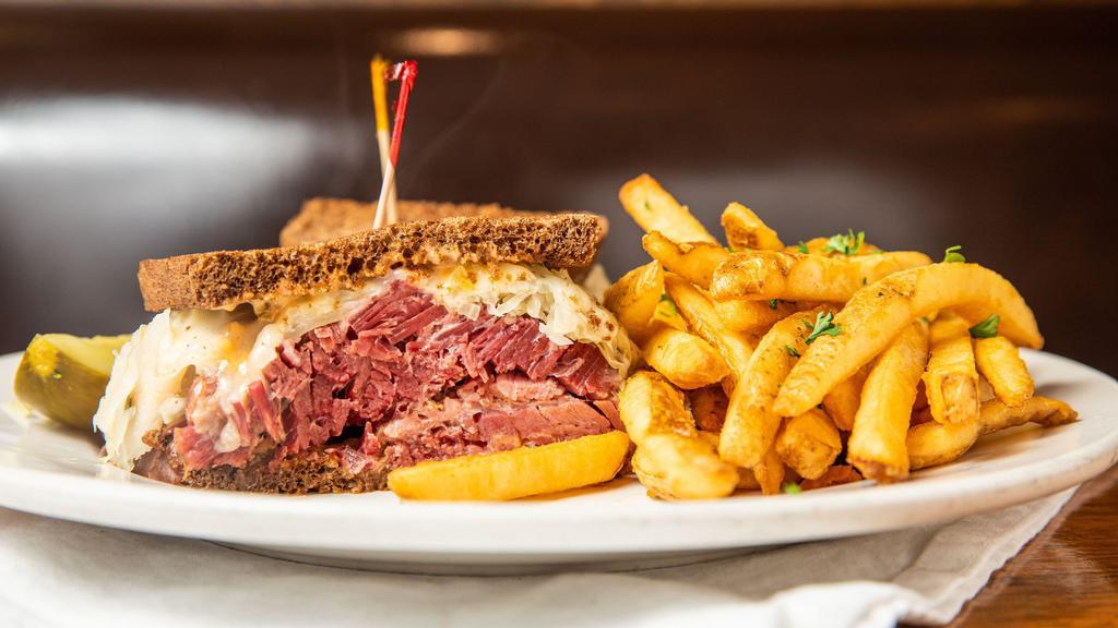 World's Best Corned Beef Reuben · Corned Beef and swiss on marbled rye with thousand island and ale steamed sauerkraut.