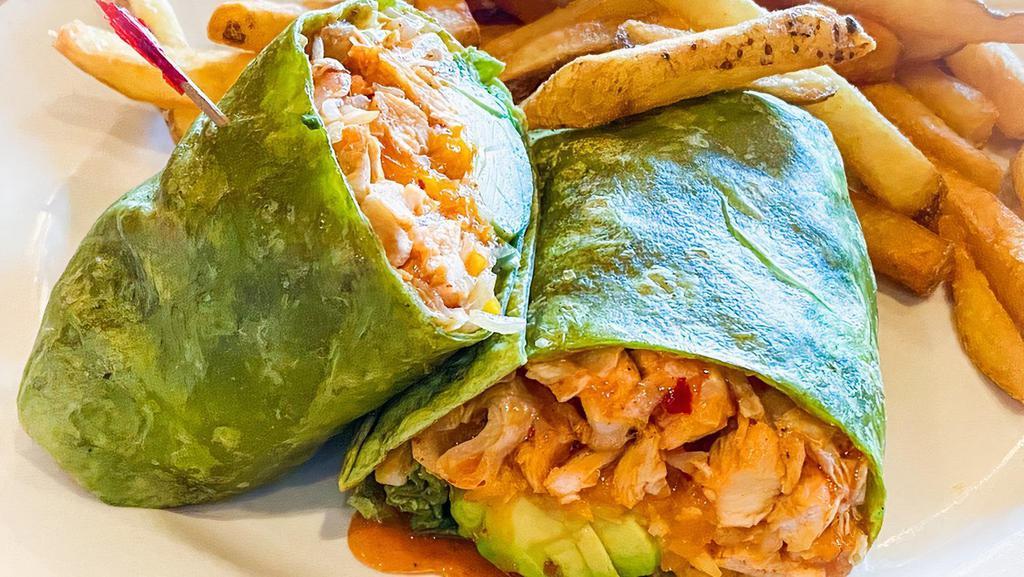Thai Chicken Wrap · A spinach flour tortilla filled with chicken tossed in a Thai chili sauce, avocado, lettuce, jack and cheddar cheeses with your choice of fries, garlic fries, onion rings, small house salad, mash and gravy or fresh fruit.