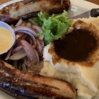 Bangers & Mash · British-style sausages with grilled red onions served with mashed potatoes and gravy.