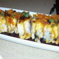 Lion King Roll · California roll topped with baked salmon.