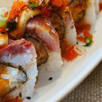 Double Double Roll · Deep fried salmon inside topped with seared hamachi, green onion, mayo, tobiko and house spe...