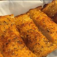Garlic Bread · Bread, topped with garlic butter, herb seasoning, baked to perfection. Melts in your mouth a...