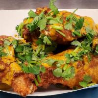 Indian Curry Wings · Wings loaded with our special curry sauce