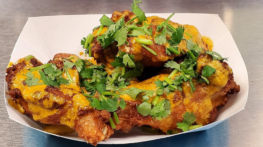 Indian Curry Wings · Wings loaded with our special curry sauce