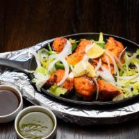 Chicken Tikka Kebabs · Marinated boneless pieces of chicken that are skewered & cooked in a clay oven until just te...