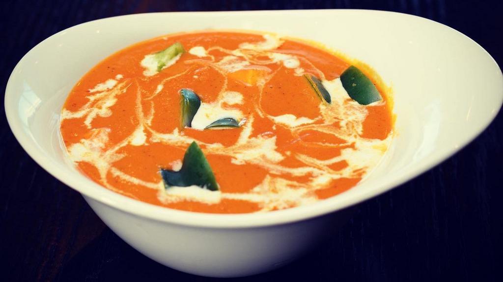 Paneer Tikka Masala (N) · Flavorful and aromatic curry, made with marinated and grilled paneer cubes simmered in a rich onion tomato gravy along with warm spices.