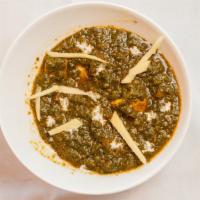 Palak Paneer · Cubes of cottage cheese tossed in a thick paste made from puréed spinach & seasoned with Ind...