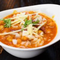 Chana Masala · Wildly popular dish from the Indian subcontinent made of chickpeas (chana) simmered in a fei...