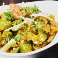 Masala Okra · Fresh okra sautéed with onion, diced tomatoes and spices with a sprinkle of cilantro.