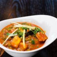 Mutter Paneer · Cubes of cottage cheese cooked with peas in tomato based sauce, spiced with garam masala.