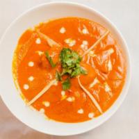 Butter Chicken (N) · Marinated chicken is roasted and cooked in tomato puree, cream and masalas