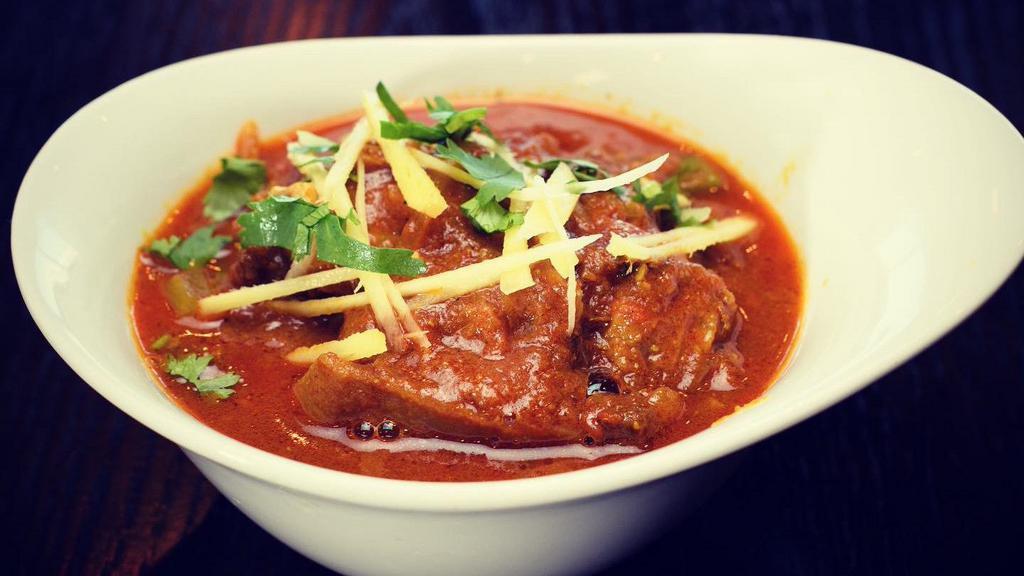 Goat Curry · Goat meat cooked in a onion-tomato gravy