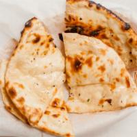 Butter Naan · Vegetarian. Fresh flour bread with melted butter on top.
