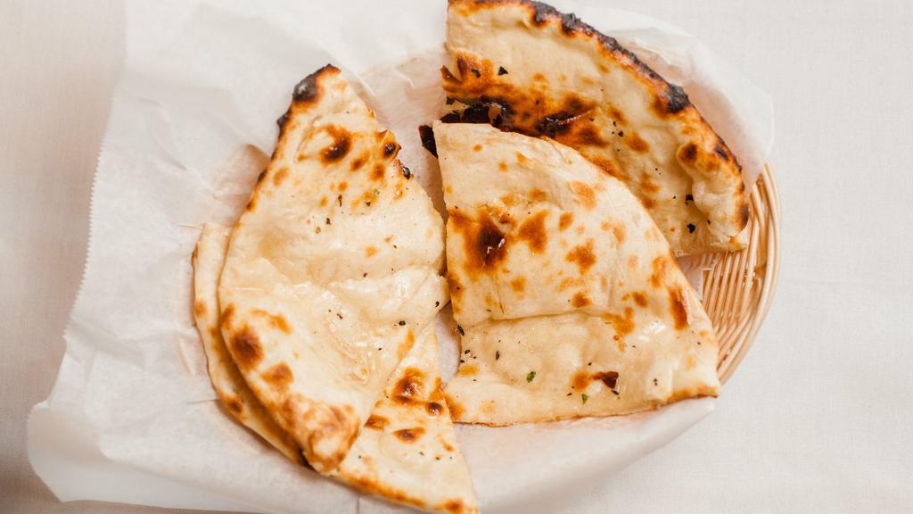 Butter Naan · Vegetarian. Fresh flour bread with melted butter on top.