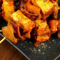 Methi Paneer Tikka (4 pieces) · Gluten free. Cottage cheese, bell pepper, onion marinated in spices and skewered in a clay o...