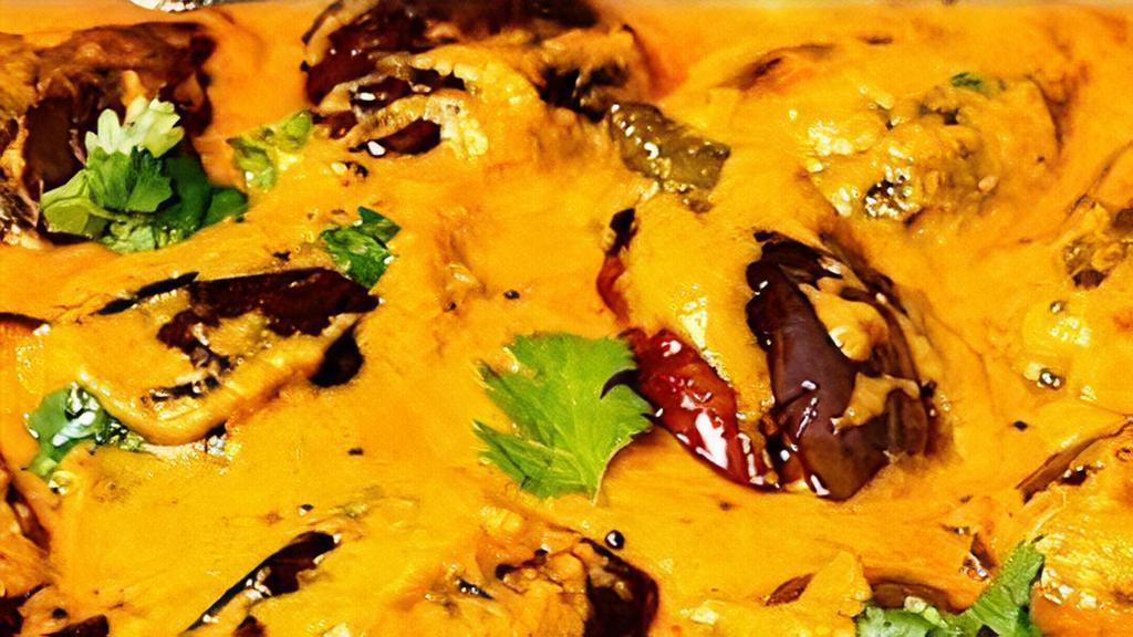 Eggplant tasty Curry · (Vegan) ,gluten free. Indian eggplant, roasted peanut, poppy seed, mustard seed, coconut milk and curry leaves.