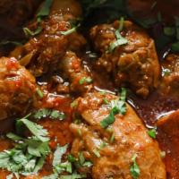 Incredible Chicken Curry · Gluten free. Boneless chicken cooked with cumin, turmeric, ginger, garlic, onion, tomato and...