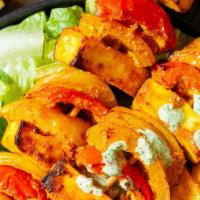 Paneer Tikka (8 Cubes) · Gluten free. Cottage cheese marinated in hung yogurt and spices skewered in clay oven.
