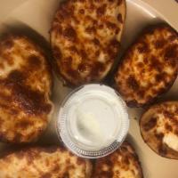 Cheese Filled Potato Skins · Filled with Mozzarella cheese and served with our house made Dutchman's Ranch.