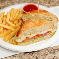 Chicken Sandwich · Grilled marinated chicken breast, mayo, lettuce, tomatoes, and onions.