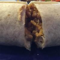 Super Burrito · Super whole beans, pico de gallo, sour cream, guacamole and your choice of meat.