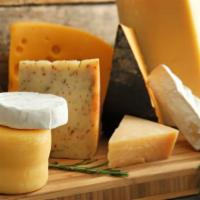 Sharp Cheddar · A firm light yellow to orange colored cheese with a smooth texture & sharp flavor, aged over...