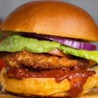 Unbelievaburger · Add a twist to the burger with some crispy fried chicken topped with sliced tomatoes, shredd...